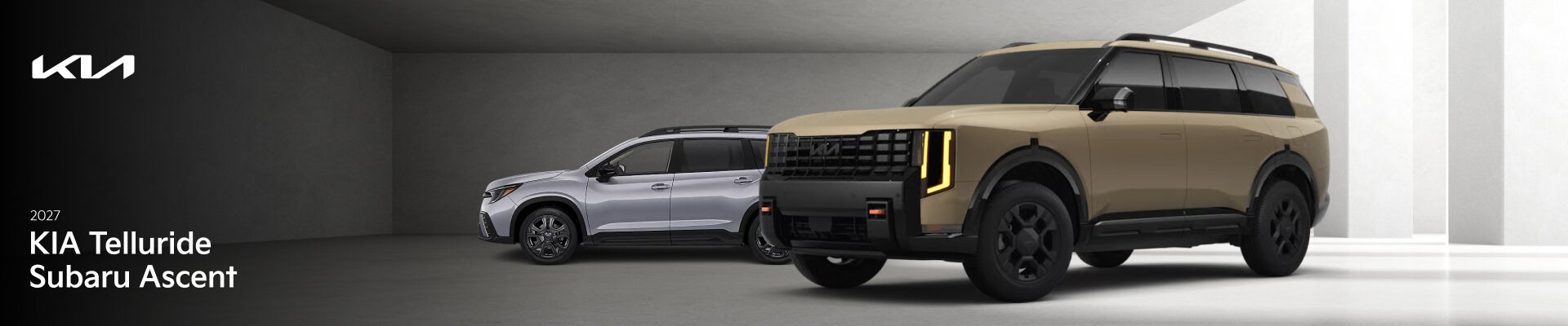 A silver 2027 Subaru Ascent and a gold 2027 Kia Telluride parked side by side in a minimal white parking garage.